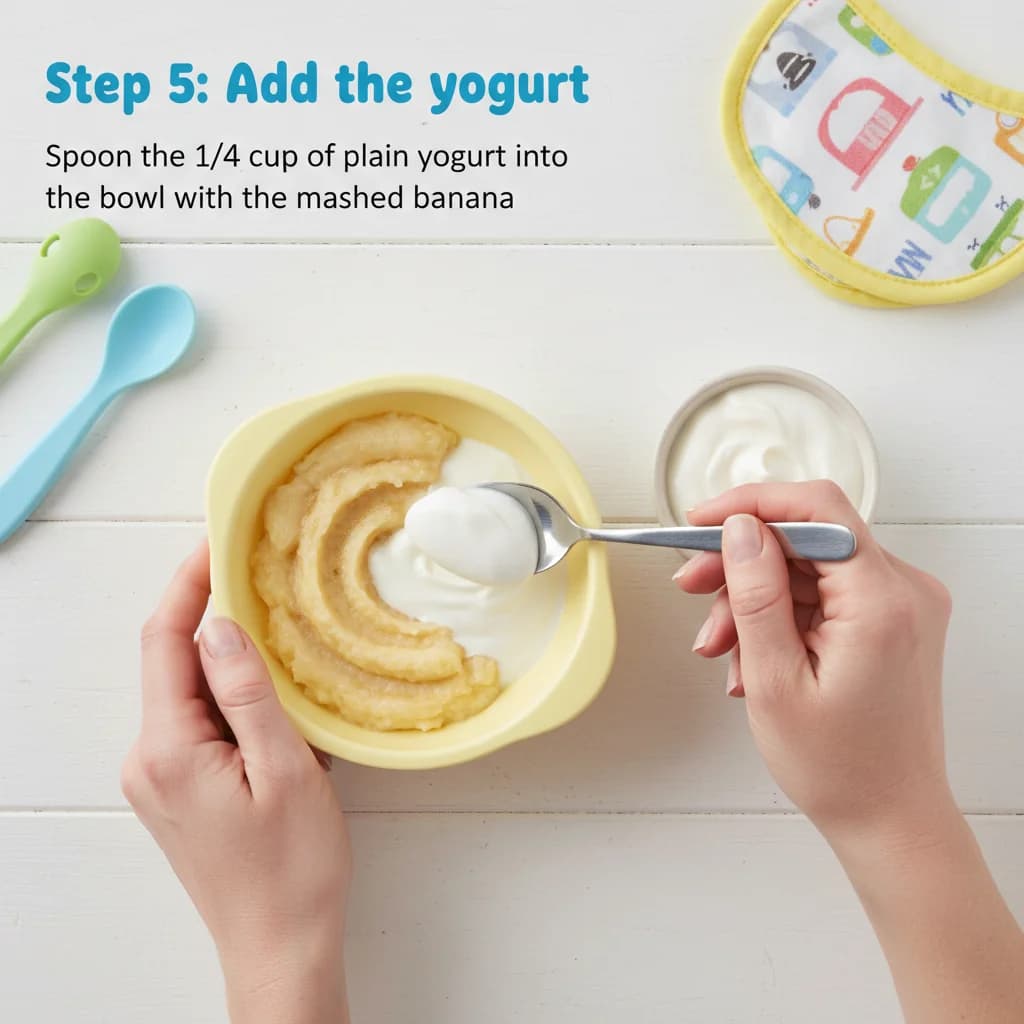 Step 5: Add the yogurt: Spoon the 1/4 cup of plain yogurt into the bowl with the mashed banana. for Baby's First Yogurt with Banana (Sweet & Creamy)