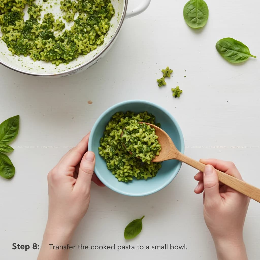 Step 8: Transfer the cooked pasta to a small bowl. for Baby's First Pesto Pasta (Spinach & Basil)