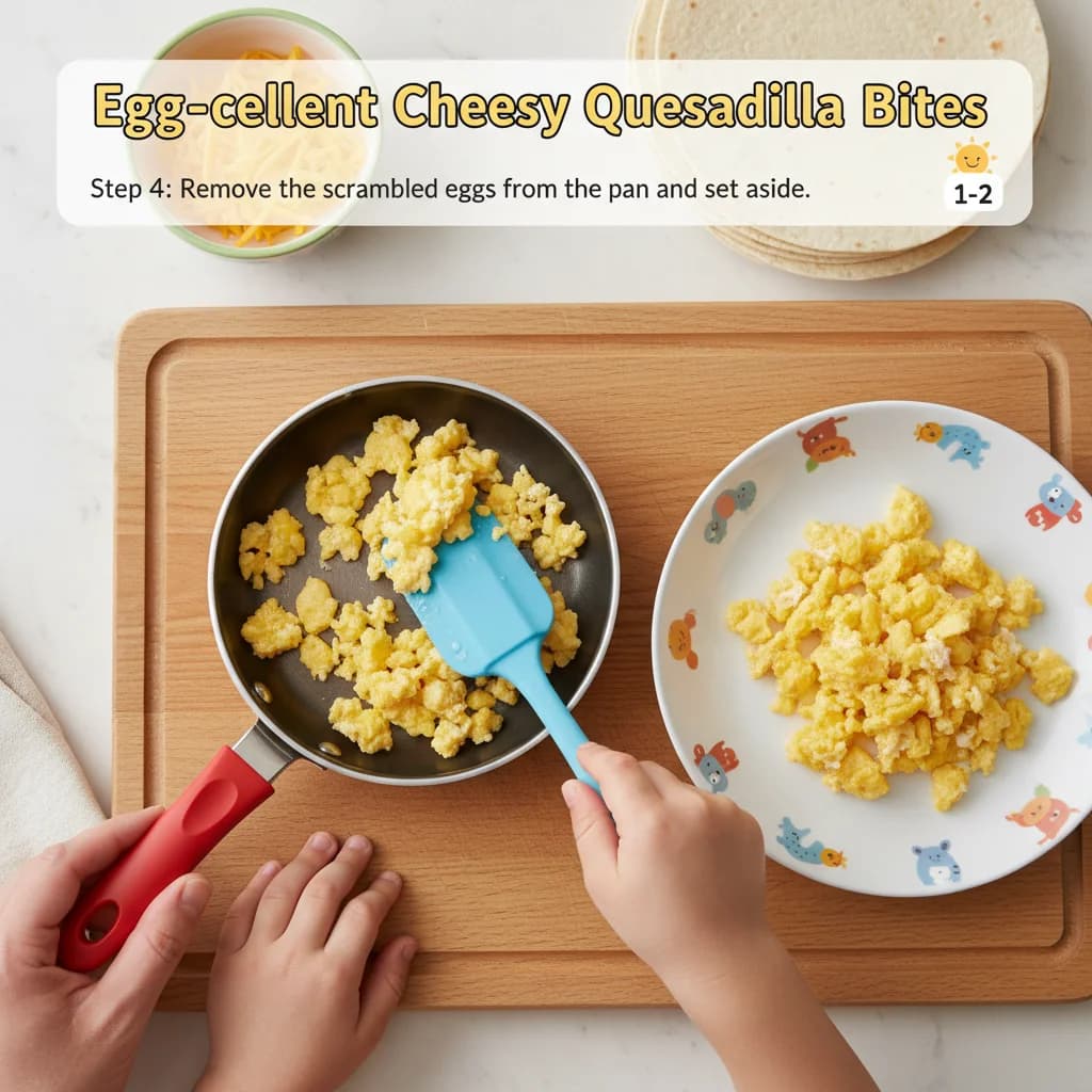 Step 4: Remove the scrambled eggs from the pan and set aside. for Egg-cellent Cheesy Quesadilla Bites